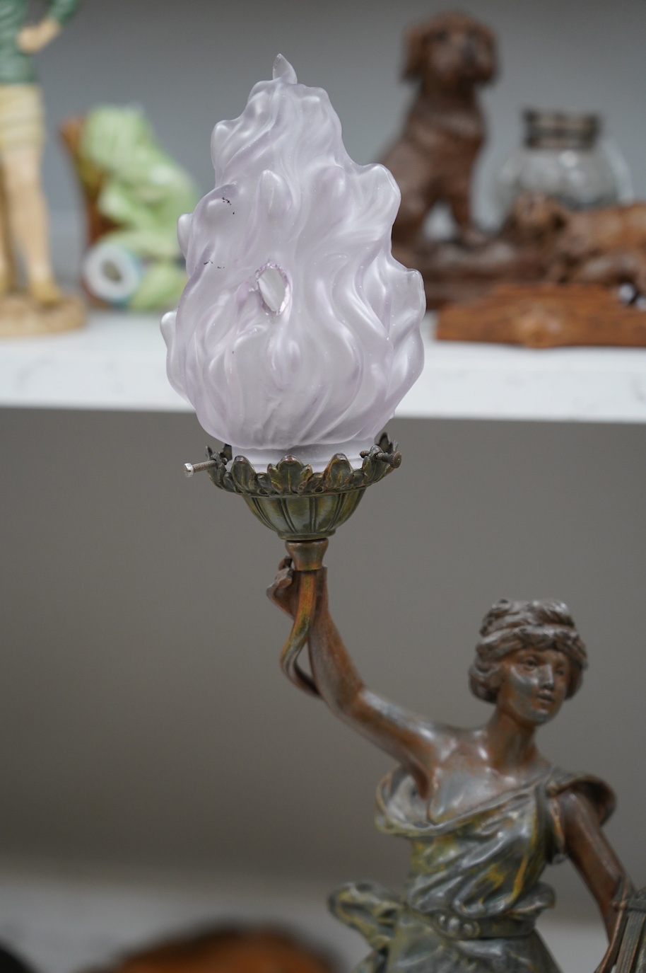 After Guillemin (1841-1907), a pair of spelter figural lamps with frosted glass shades, overall 61cm high. Condition - poor to fair, damage to glass